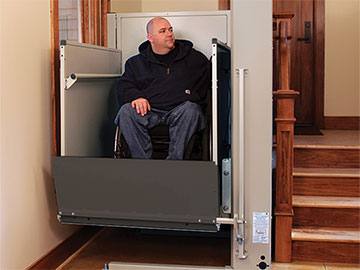 a man using a platform lift and other Top-Quality Ramps and Vertical Platform Lifts for Blackwood, New Jersey